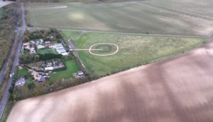 An aerial view of Country Boarding for Cats and Dogs 18 acre site in Hertfordshire showing the buildings and dog park
